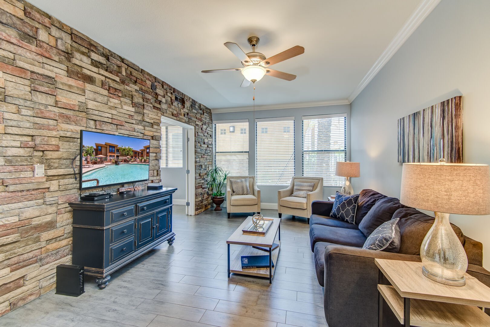 living area with tv and couch in one of our Condo Rentals in Scottsdale